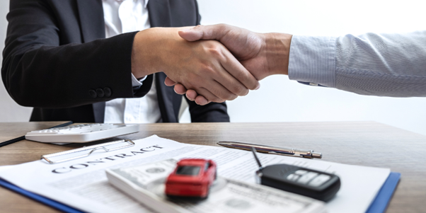 Finance specialist helping a customer with car financing